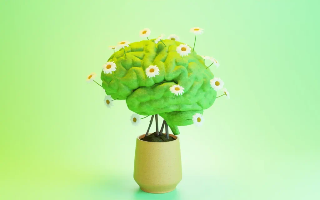 Grafik eines Gehirns mit Blumen gespickt