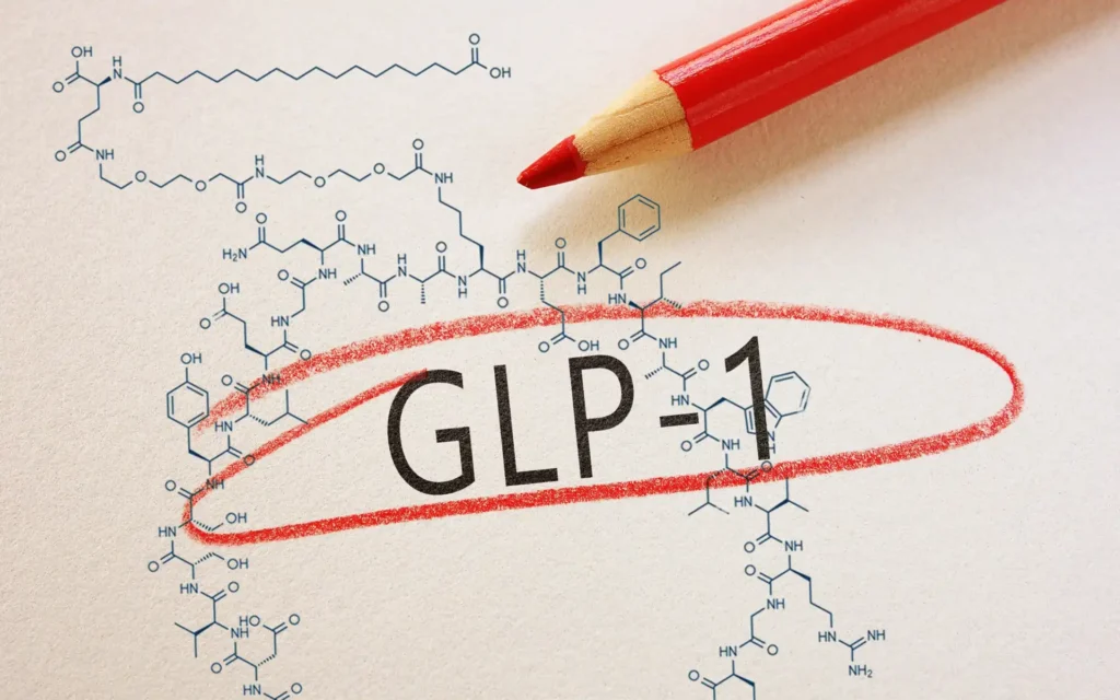 Schriftzug GLP-1 mit rotem Stift