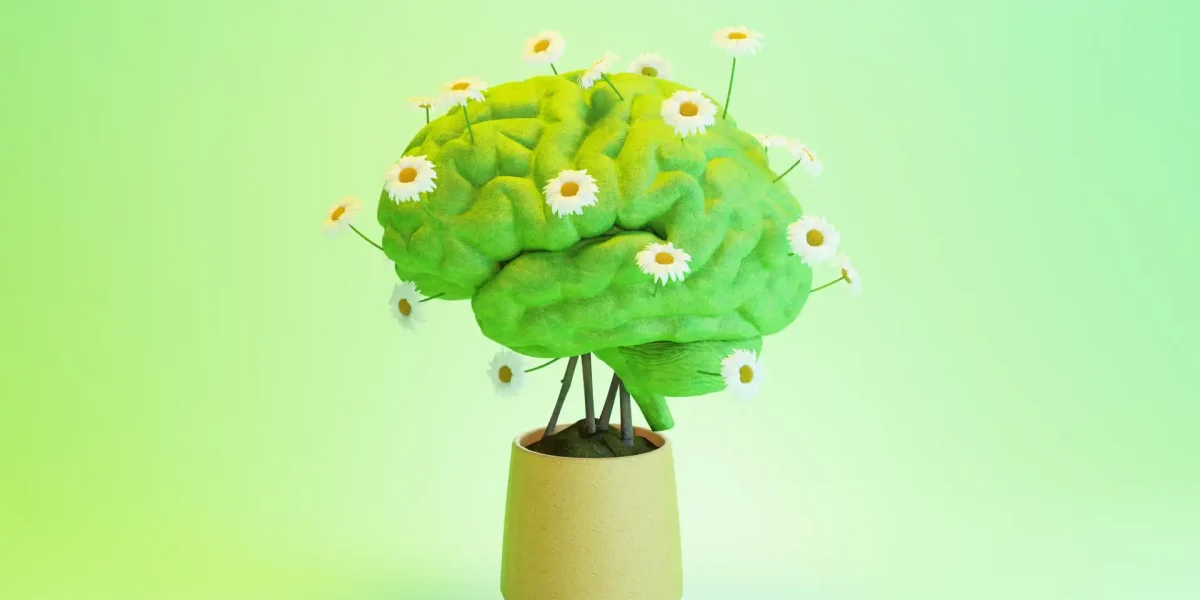 Grafik eines Gehirns mit Blumen gespickt